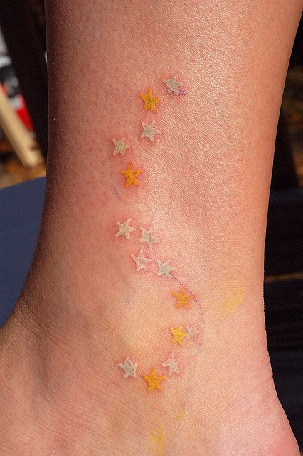 Yellow stars tattoo