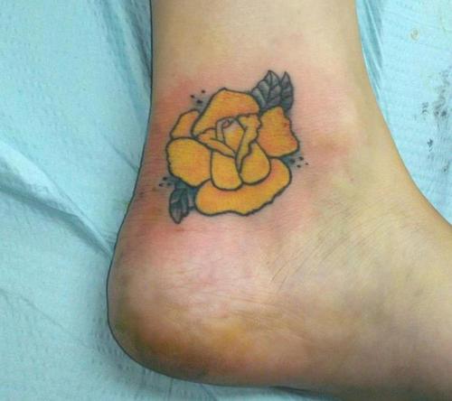 Yellow tattoo on feet