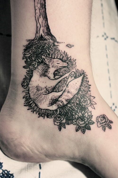 black ink sleeping fox tattoo