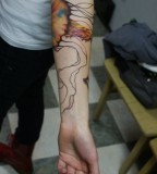 modern tattoo colour jellyfish on arm