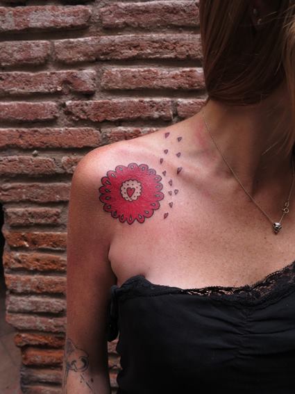 red flower tattoo on shoulder by matik