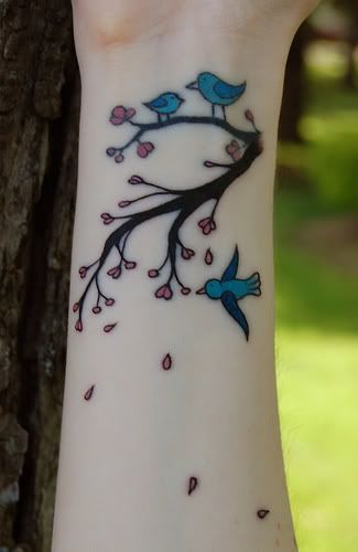 wrist tattoo bird on branch