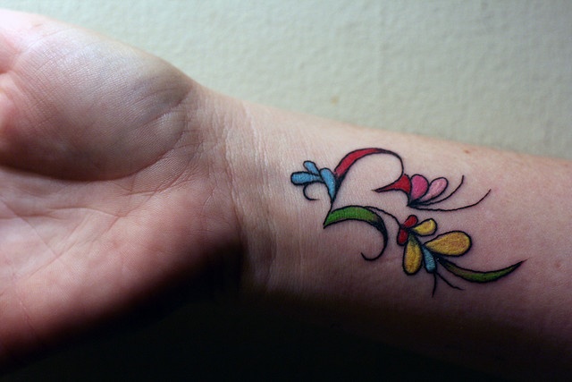 wrist tattoo colorful work