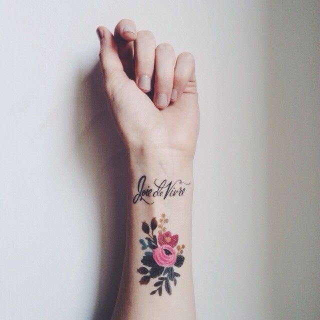 wrist tattoo flowers joie de vivre