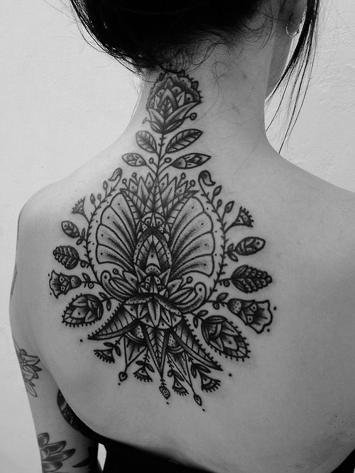 Black flowers back tattoo