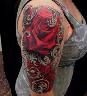 Arm red rose photorealistic tattoo