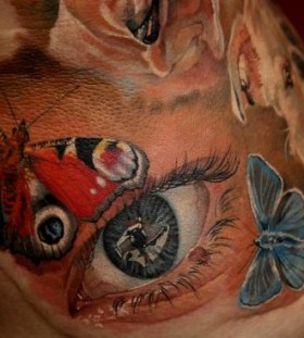 Butterflies and eye photorealistic tattoo