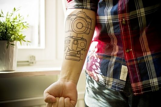 Camera details photorealistic tattoo