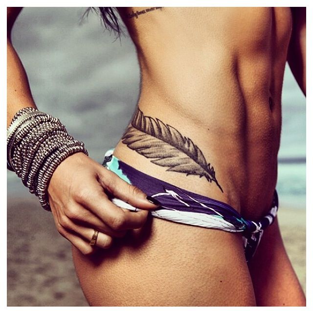 Feather hip tattoo