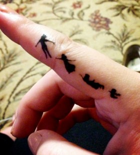 Finger Peter Pan tattoo