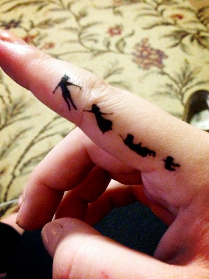 Finger Peter Pan tattoo