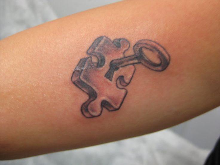 Key and puzzle tattoo