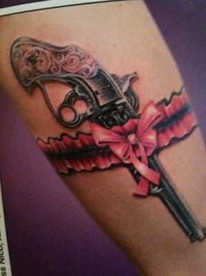 Lovely pink guns tattoo