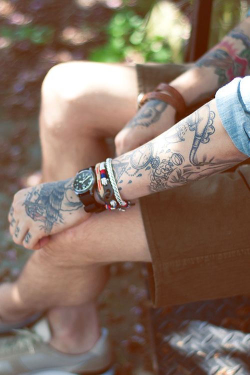 Man with tattoos sitting