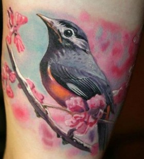 Pretty bird photorealistic tattoo