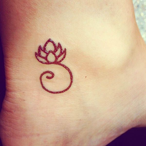 Red flowe symbols tattoo
