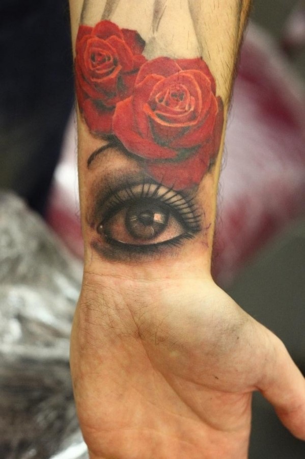 Red roses and eye tattoo