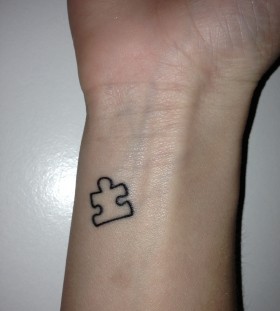 Small puzzle tattoo