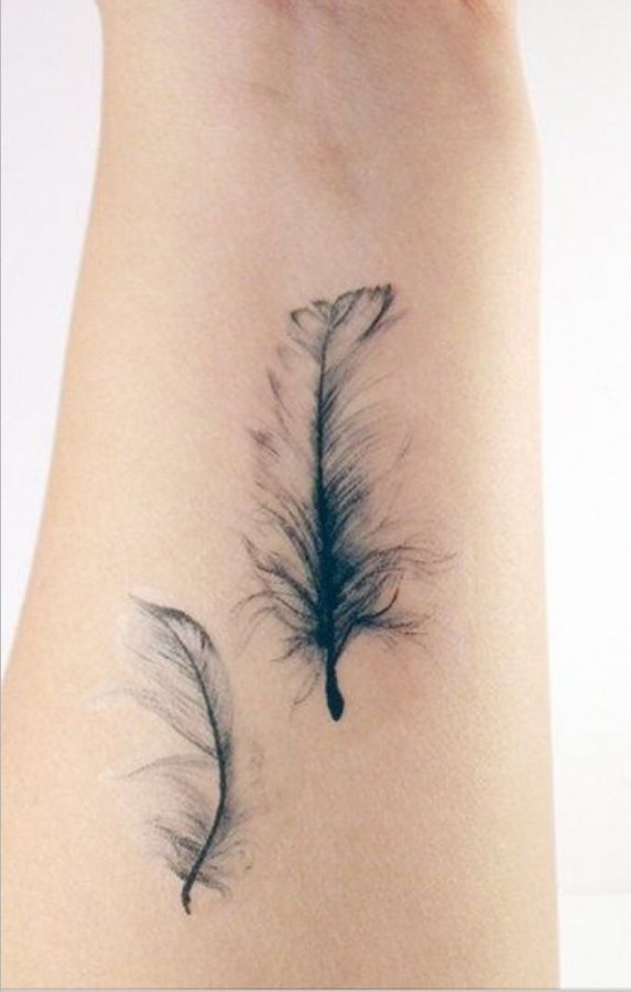 black feather tattoo looking so soft