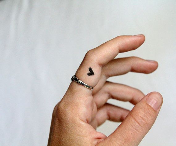 black heart tattoo  on the finger