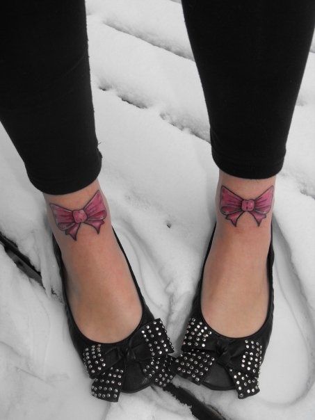 bow tattoos on both feets