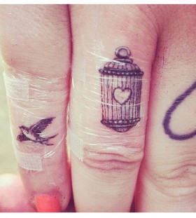 finger tattoo bird cage