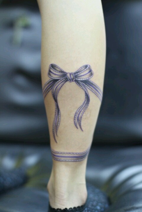 small purple tattoo ballet ballerina bow