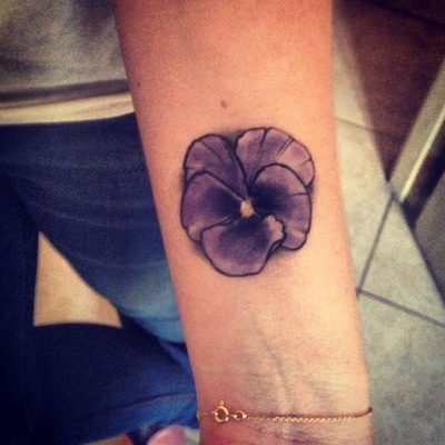 small purple tattoo flower