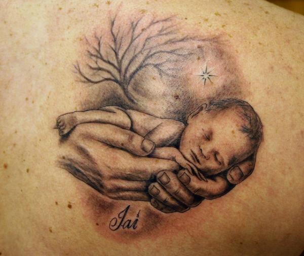 Amazing sleeping baby tattoo