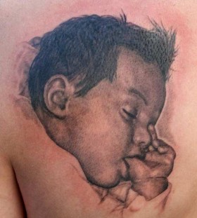 Awesome tattoo with sleeping baby