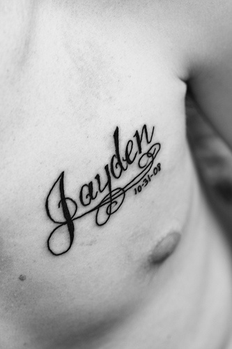 Beautiful black tattoo with kid name