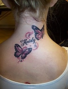 Beautiful tattoo with butterfly on the back