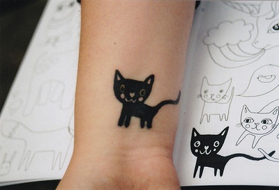 Black cat tattoo