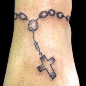 Black rosary wrist cross tattoo