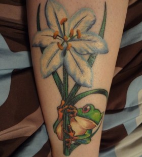 Blue flower and frog tattoo