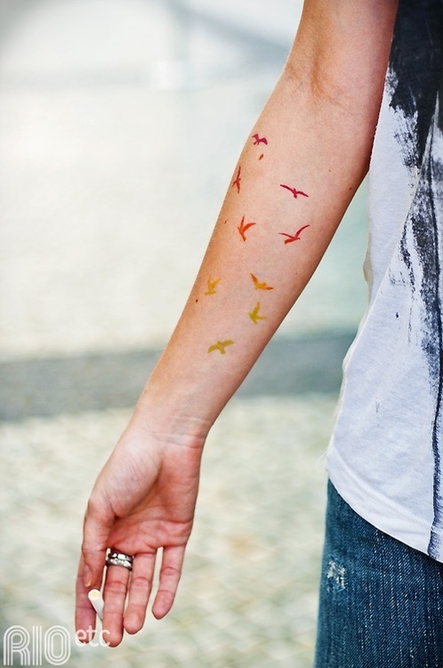 Colorful birds tattoo