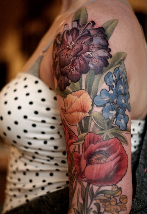 Colorful flowers tattoo by Alice Carrier