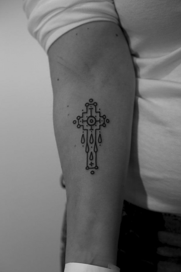 Cross tattoo by Jean Philippe Burton