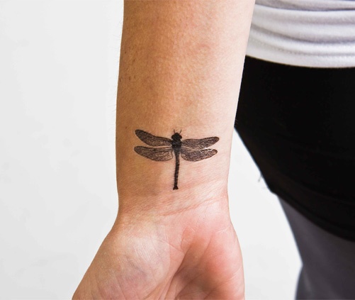 Flying bug tattoo