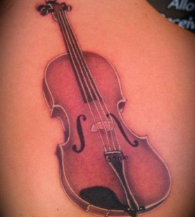 Guitar tattoo by Art Junkies