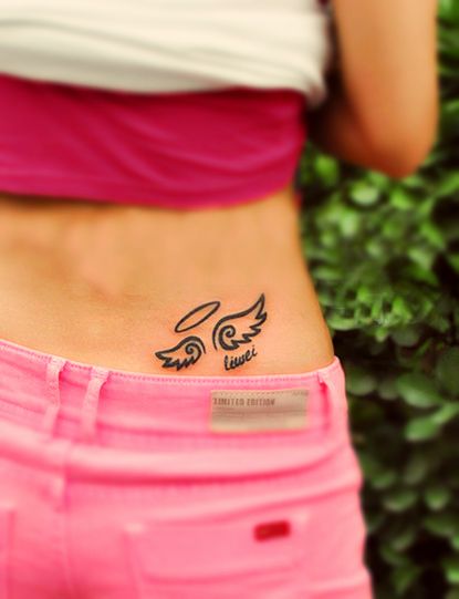 Hip wings tattoo