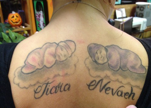 Impressive two babies tattoo on the back