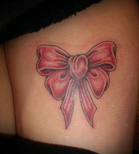 Legs bow tattoo