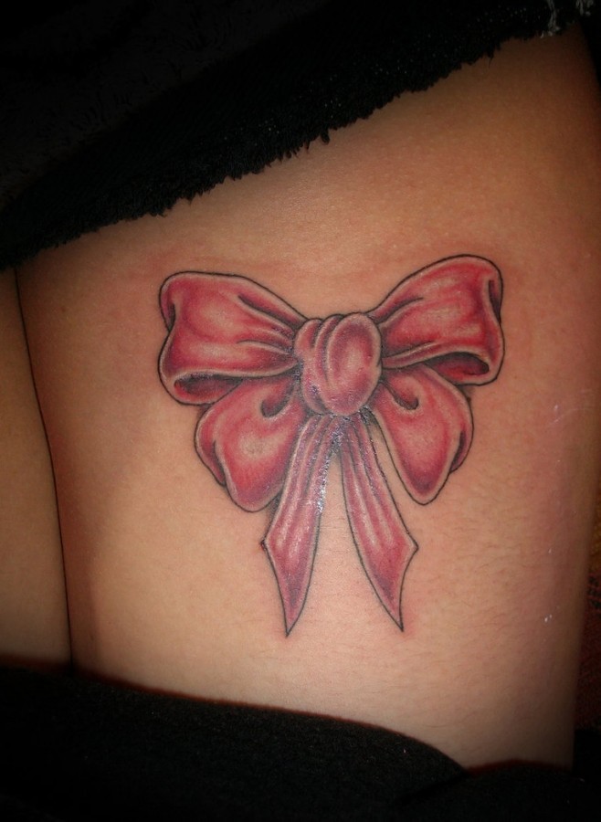 Legs bow tattoo