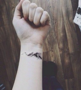 Lovely hand mountains tattoo