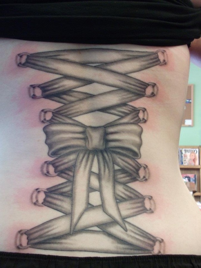 Non color corset tattoo