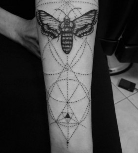 Ornaments and bug tattoo