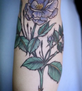 Purple flower tattoo by Alice Carrier