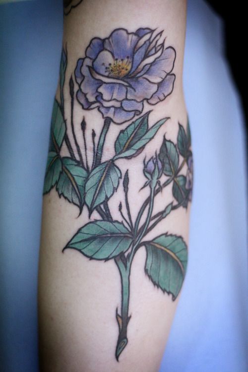 Purple flower tattoo by Alice Carrier