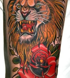 Red rose and lion tattoo